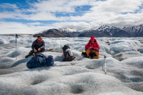 Hikers taka a lunch break while corossing the Skeiðarárjökull glacier.